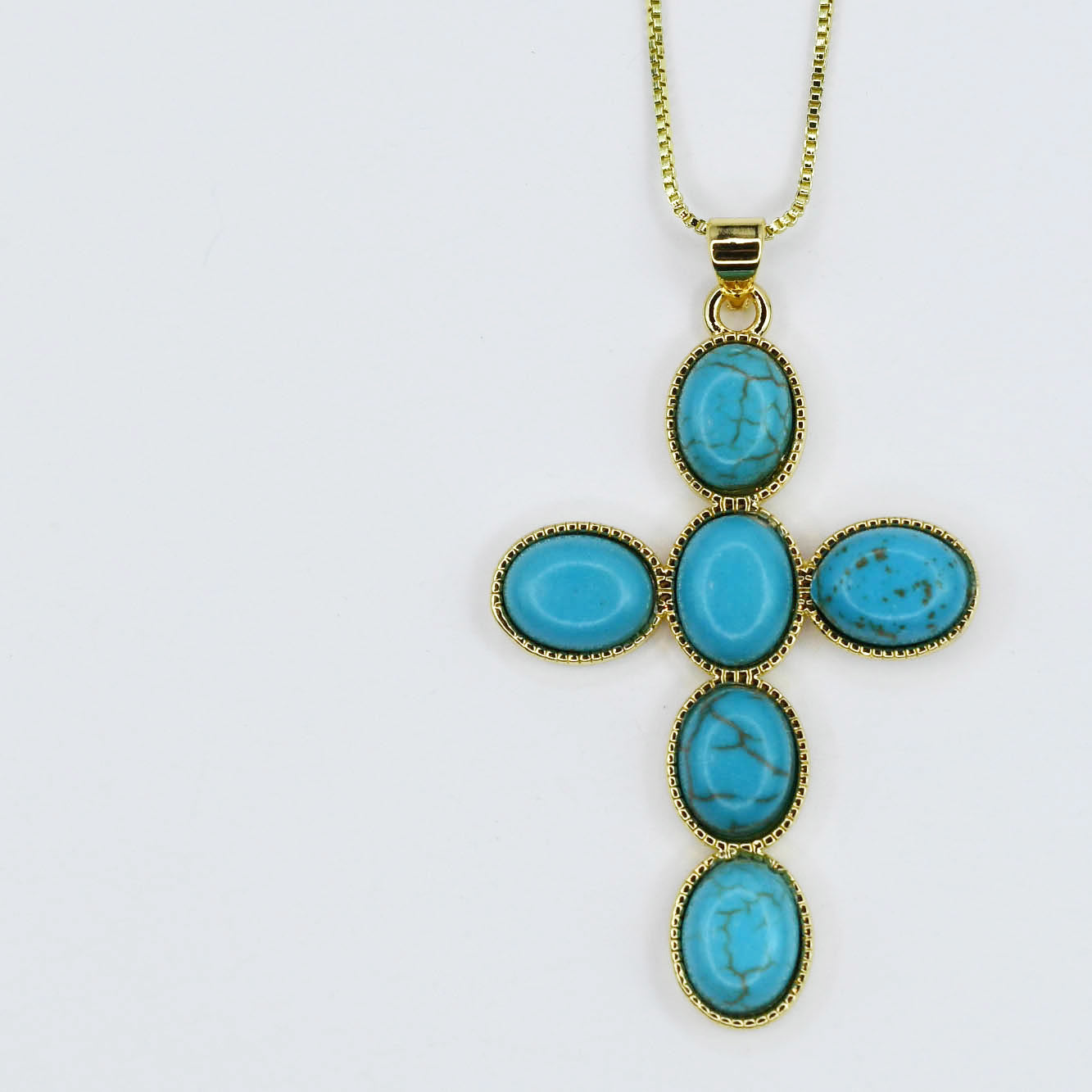 Gold necklace with turquoise cross pendant, boutique wholesale jewelry for women, boho statement accessory, waterproof and hypoallergenic necklace, tarnish-free gold chain, trendy turquoise pendant jewelry for stylish women’s boutiques