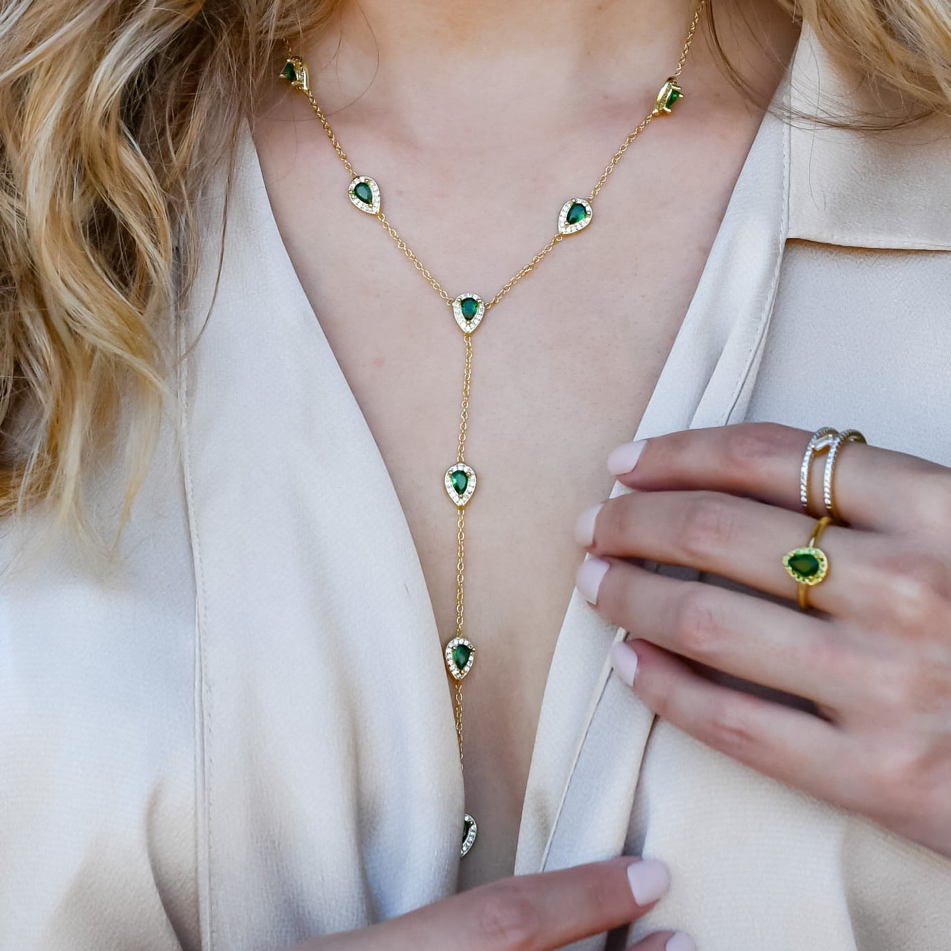 Gold Y necklace with blue teardrop gemstones, trendy statement gold necklace, boutique wholesale jewelry for women, waterproof gold necklace, hypoallergenic and tarnish-free necklace