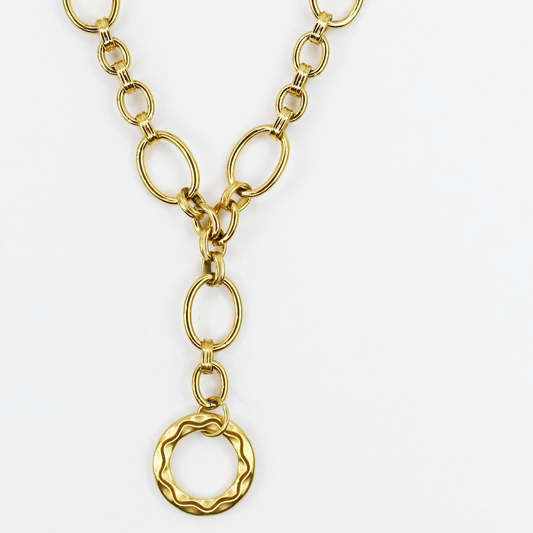 Dainty yet bold gold necklace with oversized oval chain links and hammered round pendant, boutique wholesale jewelry, waterproof tarnish-free hypoallergenic accessory, trendy statement gold necklace for women’s boutiques