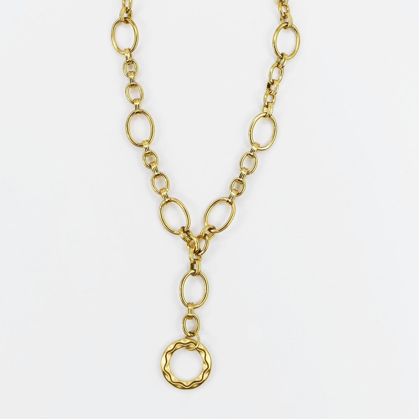 Dainty yet bold gold necklace with oversized oval chain links and hammered round pendant, boutique wholesale jewelry, waterproof tarnish-free hypoallergenic accessory, trendy statement gold necklace for women’s boutiques