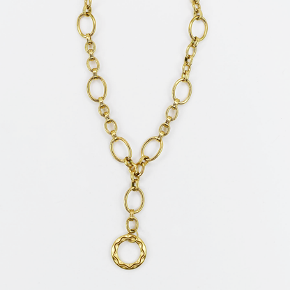 Dainty yet bold gold necklace with oversized oval chain links and hammered round pendant, boutique wholesale jewelry, waterproof tarnish-free hypoallergenic accessory, trendy statement gold necklace for women’s boutiques