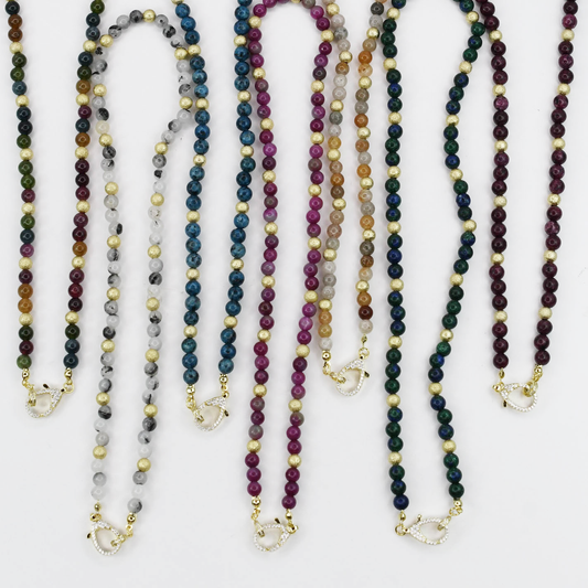 Colorful charms gold necklace featuring gemstone details, layered jewelry design, trendy accessory for women’s jewelry collections, boutique wholesale fashion necklace that is hypoallergenic, tarnish free, and waterproof jewelry with a cute aesthetic statement style,tiger eye tones